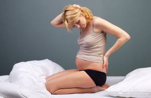 Остеохондроз при беременности: причины, симптомы, лечение